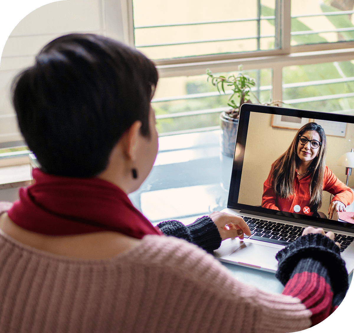 Video call between two women on laptop.