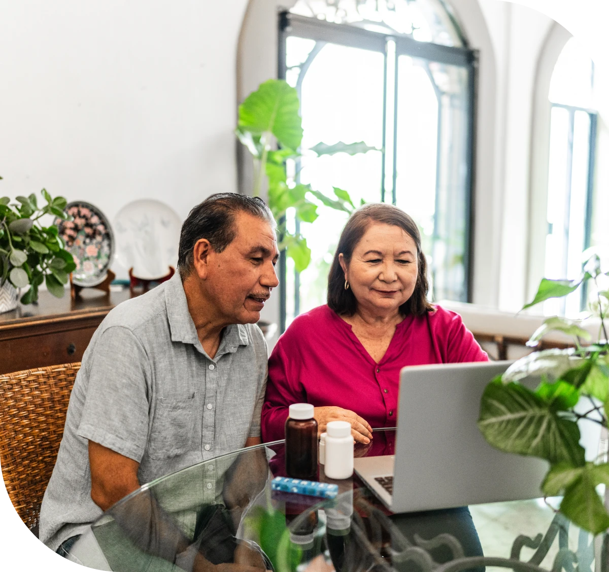 Older couple video calling on laptop.